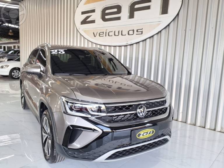 VOLKSWAGEN - TAOS 1.4 16V HIGHLINE TSI FLEX 4P AUTOMÁTICO - 2023/2023 - BEGE - R$ 167.900,00